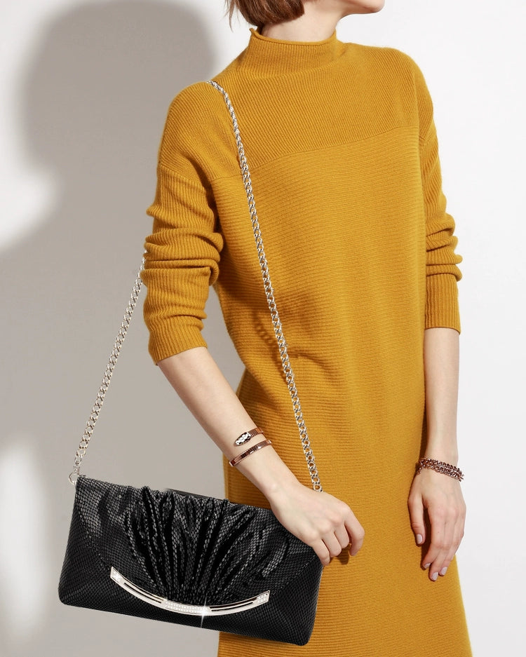 Anne Hathaway's Black Patent Clutch: The Quintessential Accessory for Minimalist Elegance