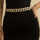 CJ Drop China two tone Cuban curb link necklace styled at the waist over a black dress summer statement chain necklace
